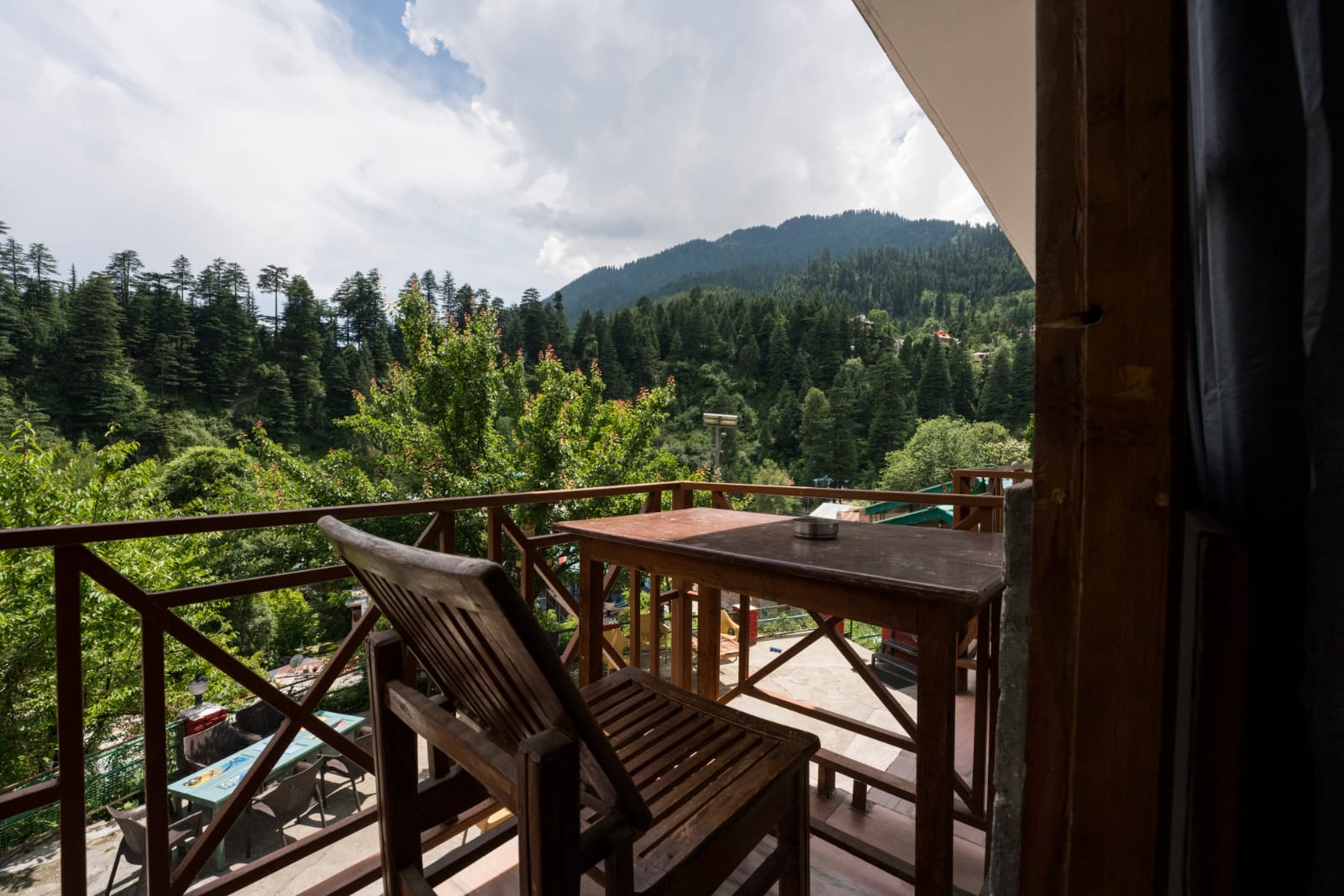 Mountain ridge and treetops seen from the balcony table