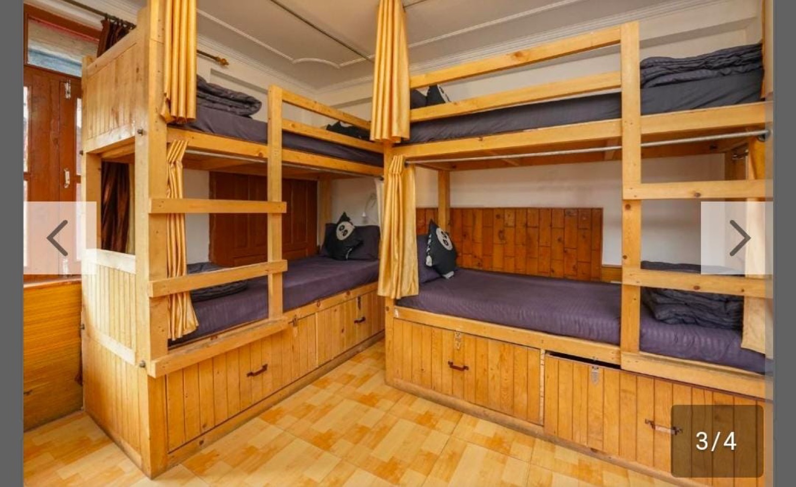 Wooden lockers along the back wall of the dorm