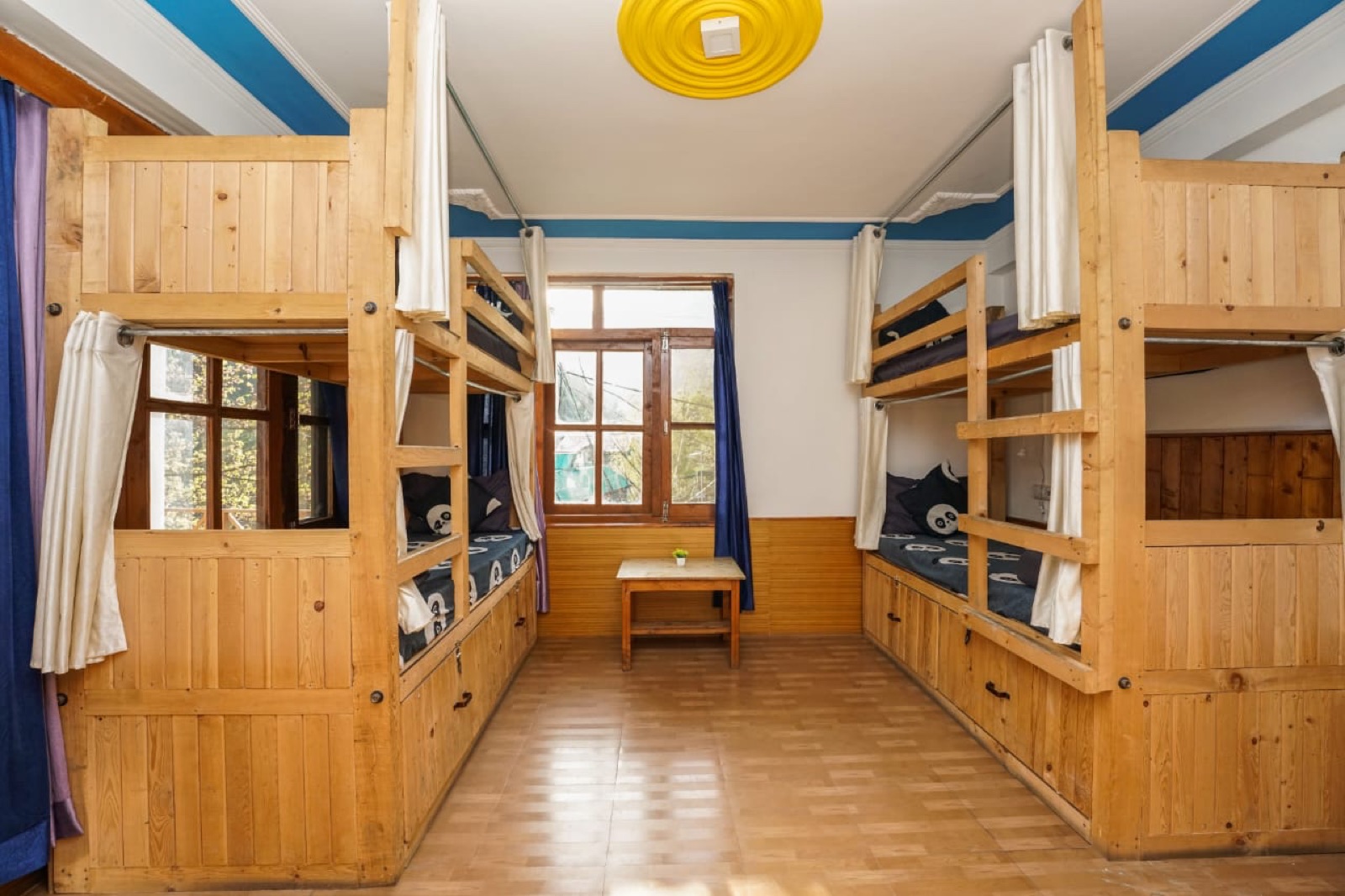 4-bed dorm room with bunk beds facing each other