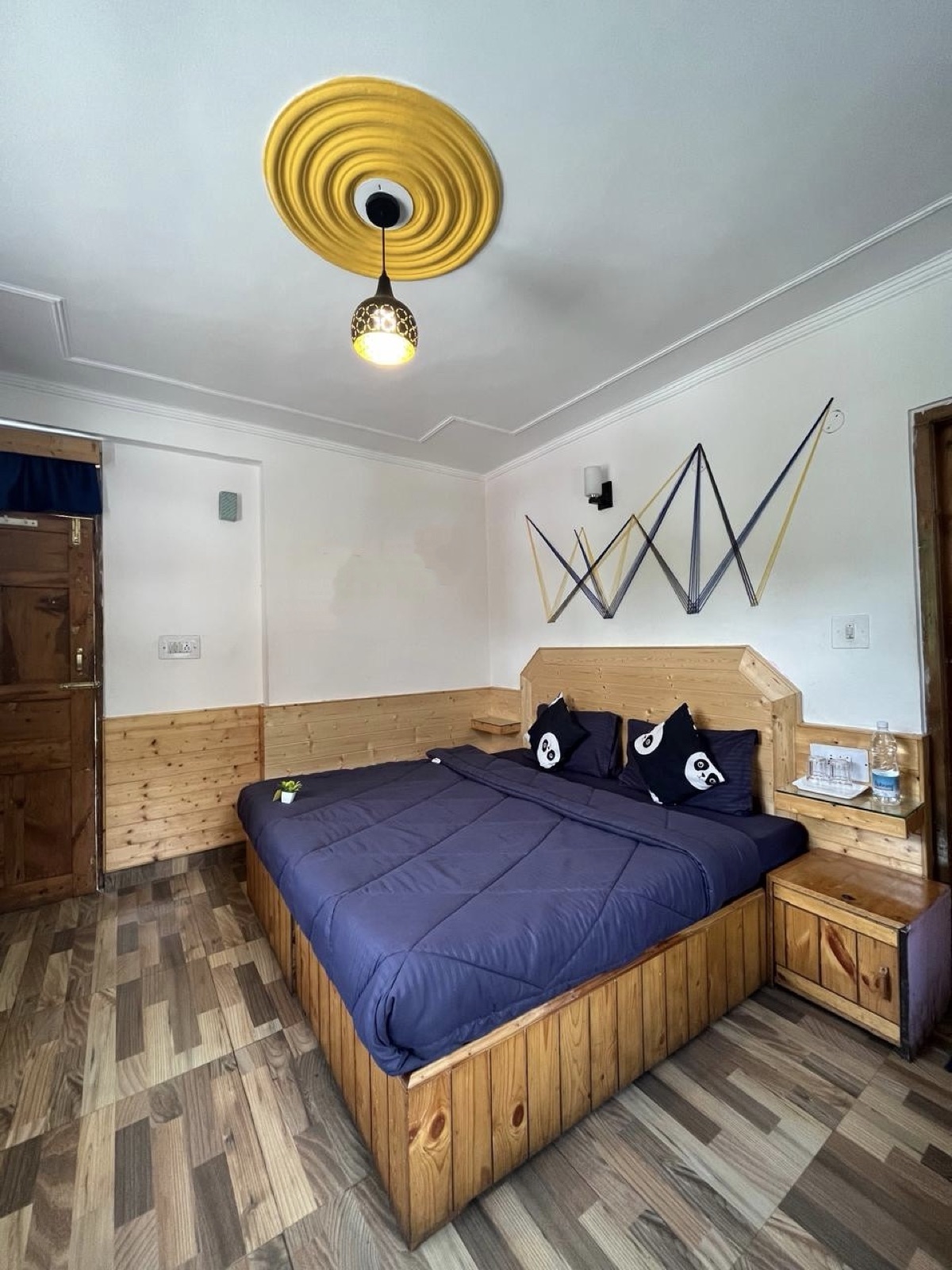 Private room bed made, panda-print pillows